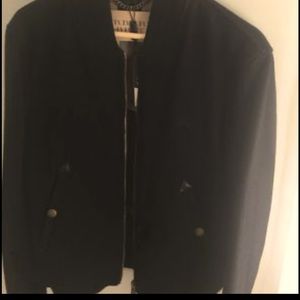 Men medium Burberry jacket. New with tags, never worn. Smoke free n pet free